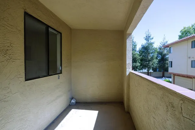 a view of a house with swimming pool and sitting area