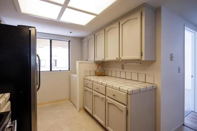 a view of a kitchen with cabinets