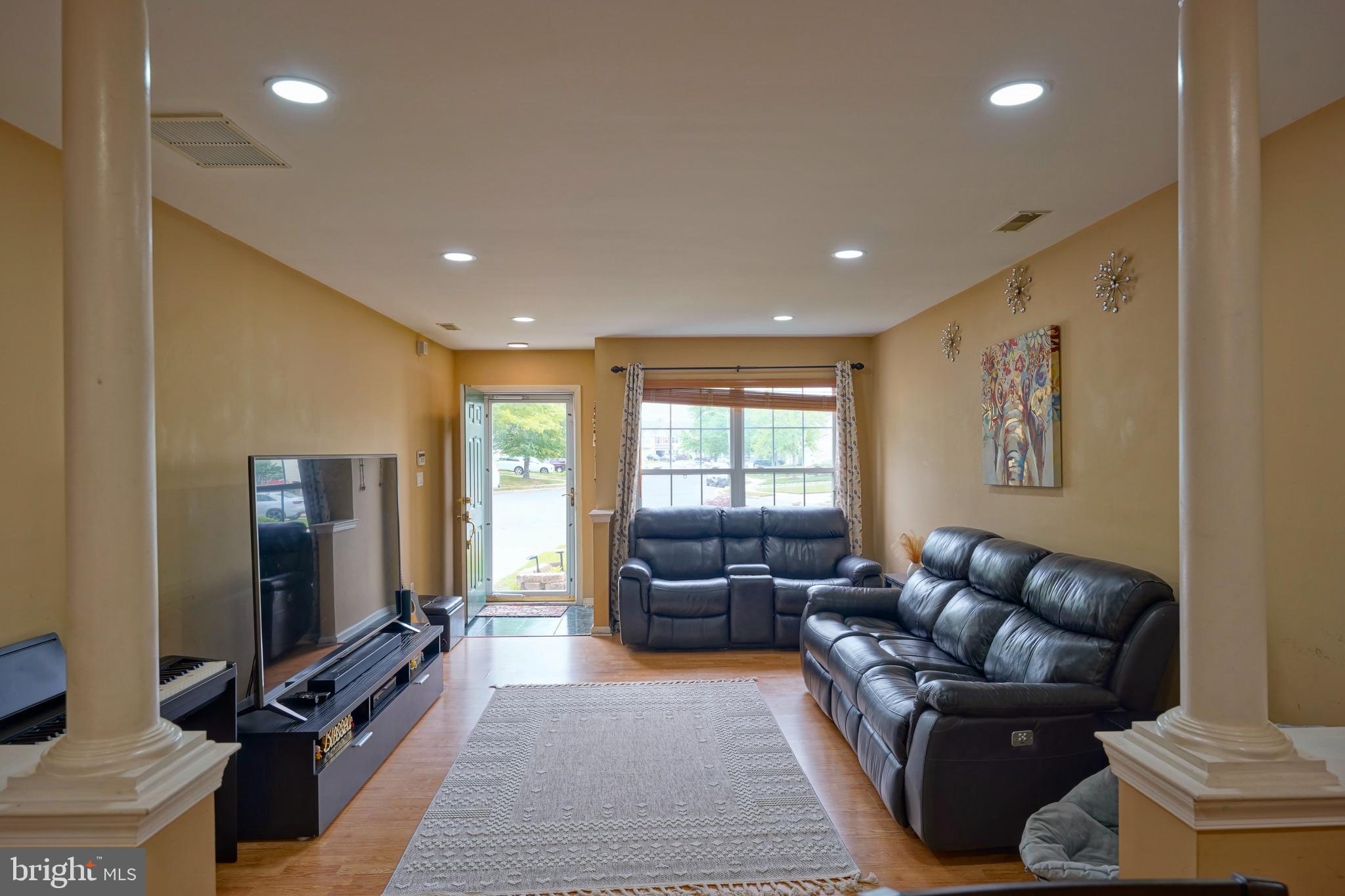 8 Saw Mill Drive Mount Laurel, NJ 08054 - Photo 11 of 37 a living room with furniture and a flat screen tv