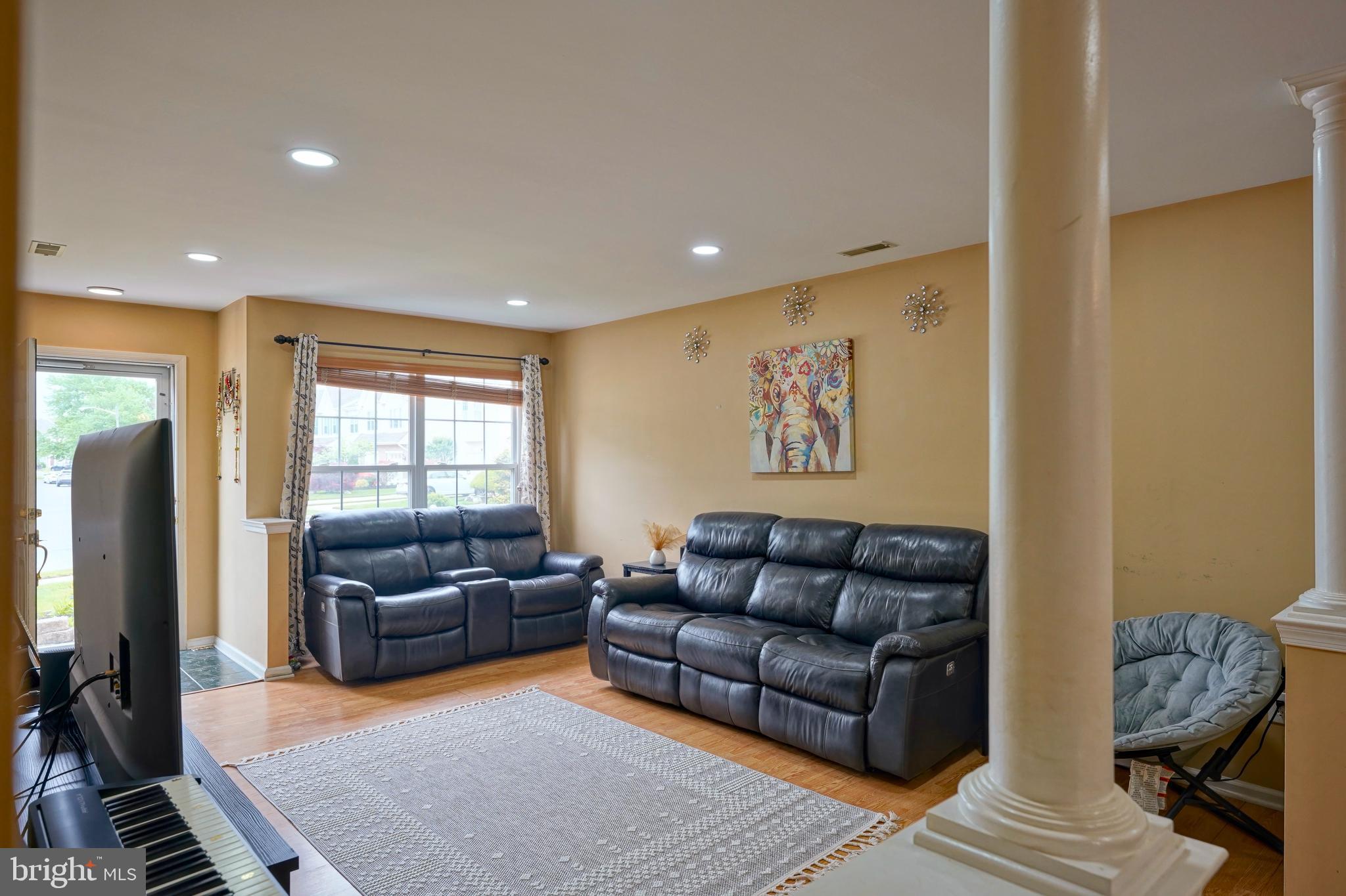 8 Saw Mill Drive Mount Laurel, NJ 08054 - Photo 12 of 37 a living room with furniture ceiling fan and a rug
