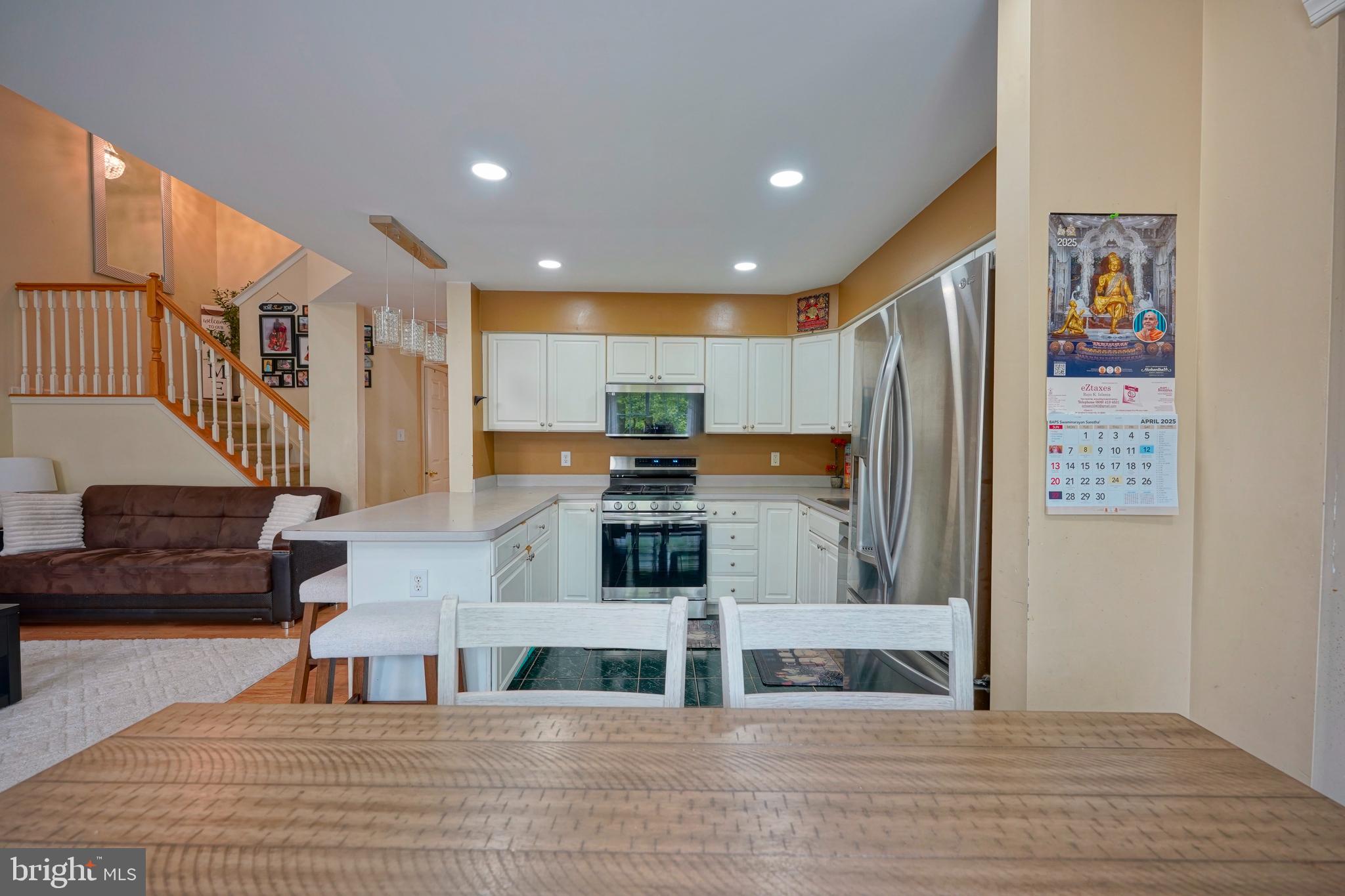 8 Saw Mill Drive Mount Laurel, NJ 08054 - Photo 19 of 37 a living room with stainless steel appliances furniture and a kitchen view