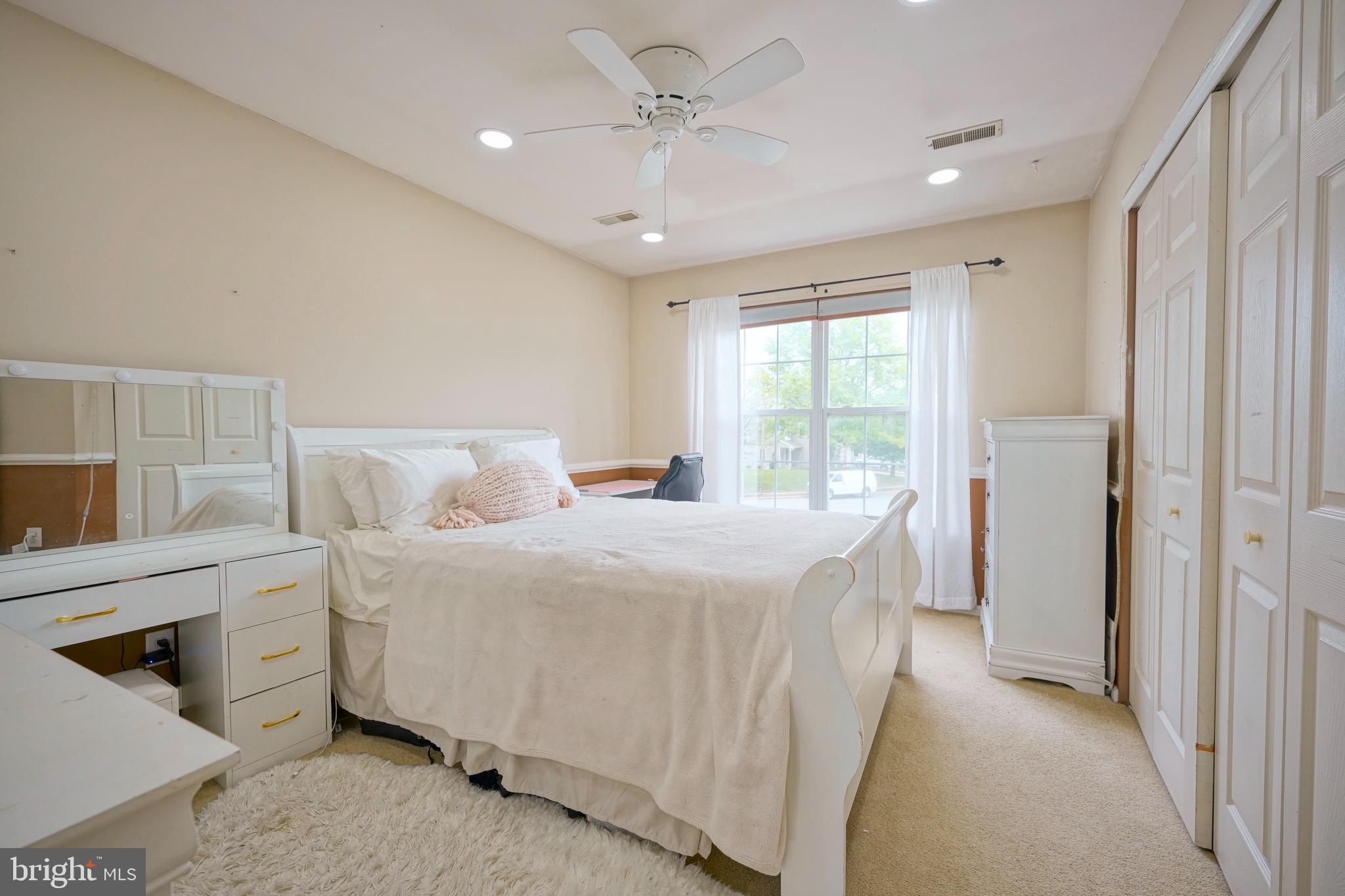 8 Saw Mill Drive Mount Laurel, NJ 08054 - Photo 31 of 37 a spacious bedroom with a bed and a chandelier