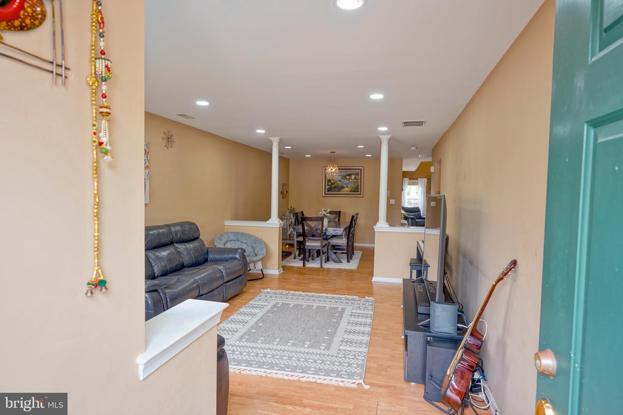 8 Saw Mill Drive Mount Laurel, NJ 08054 - Photo 10 of 37 a living room with furniture and a wooden floor
