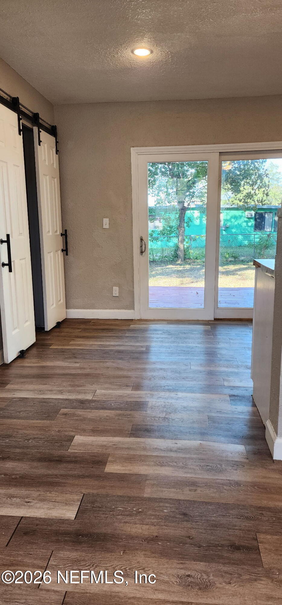 2181 West 17th Street Jacksonville, FL 32209 - Photo 15 of 27 a view of empty room with wooden floor and fan
