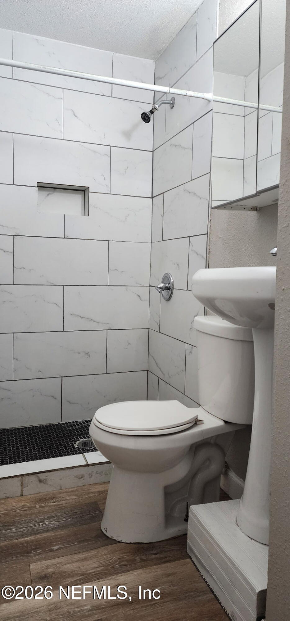 2181 West 17th Street Jacksonville, FL 32209 - Photo 21 of 27 a white toilet sitting next to a bathroom sink