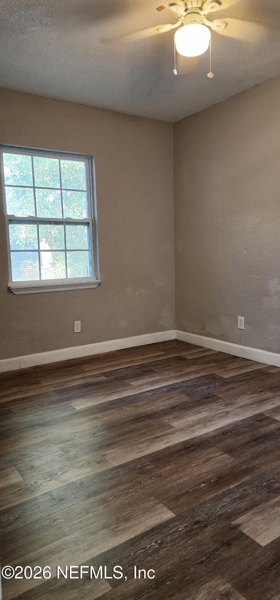2181 West 17th Street Jacksonville, FL 32209 - Photo 23 of 27 a view of a room with wooden floor and window