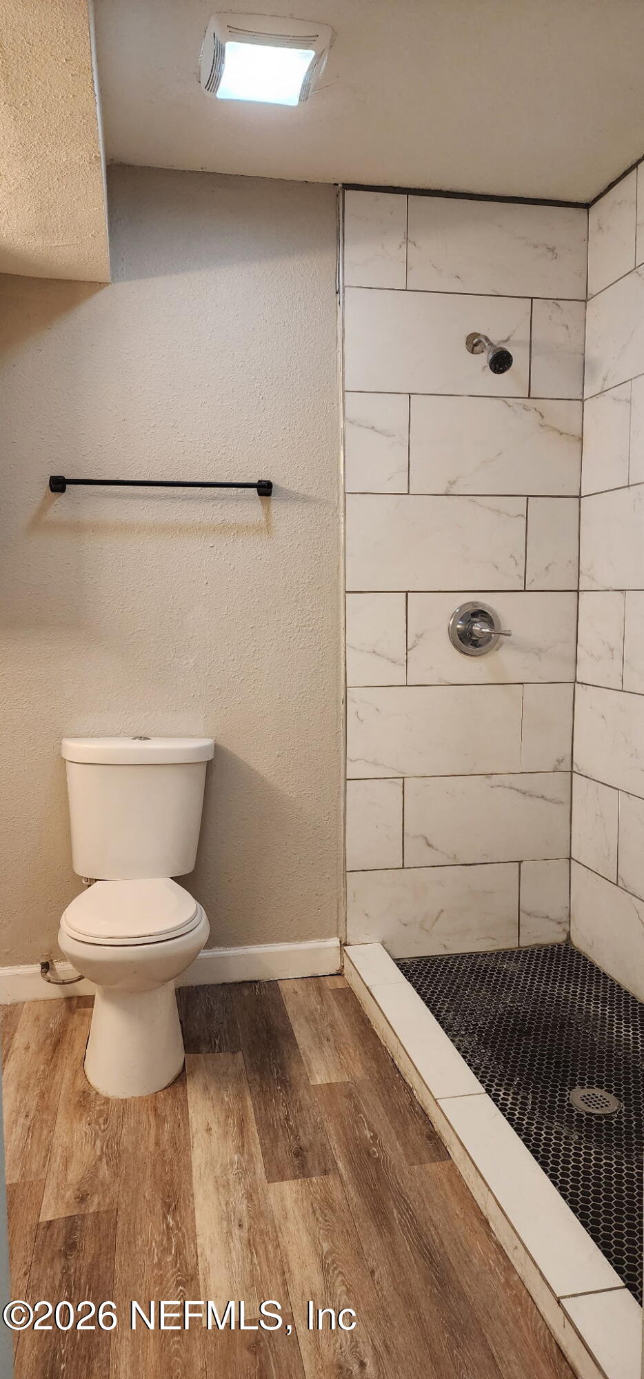 2181 West 17th Street Jacksonville, FL 32209 - Photo 26 of 27 a bathroom with a toilet and a shower