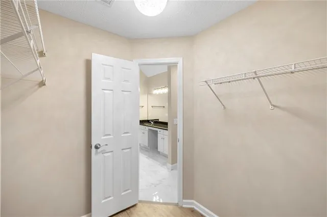 a bathroom with a shower and a sink