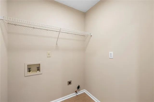 a bathroom with a shower and a window
