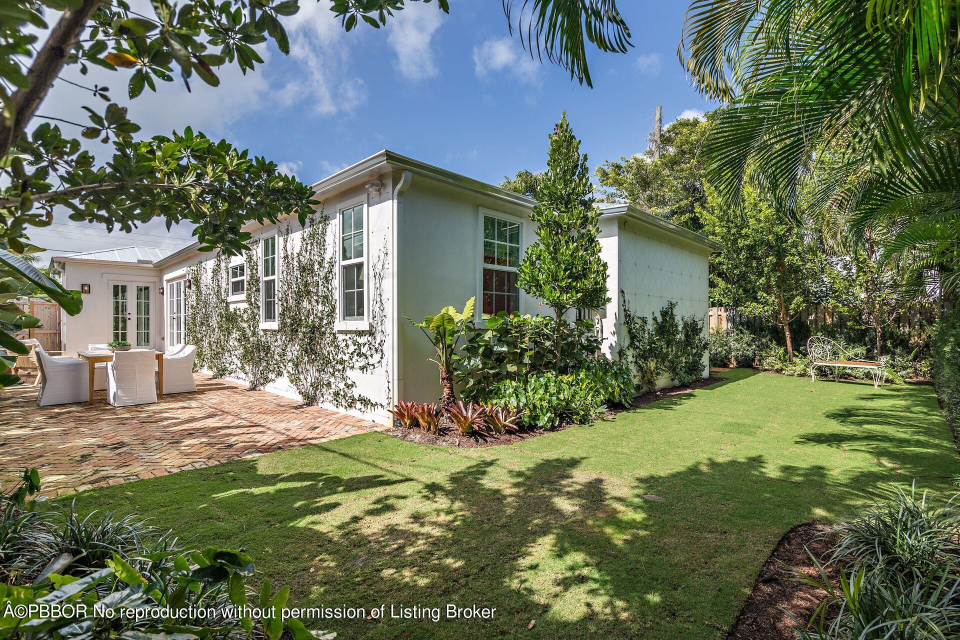 7610 Washington Road West Palm Beach, FL 33405 - Photo 11 of 12 a view of a house with a yard and potted plants