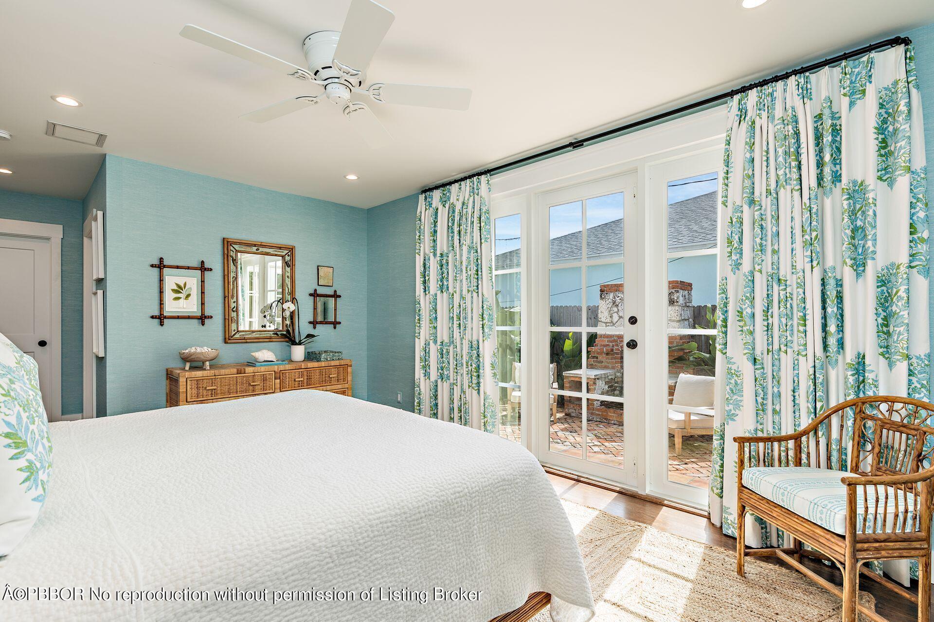 7610 Washington Road West Palm Beach, FL 33405 - Photo 6 of 12 a bedroom with a large bed and wooden floor