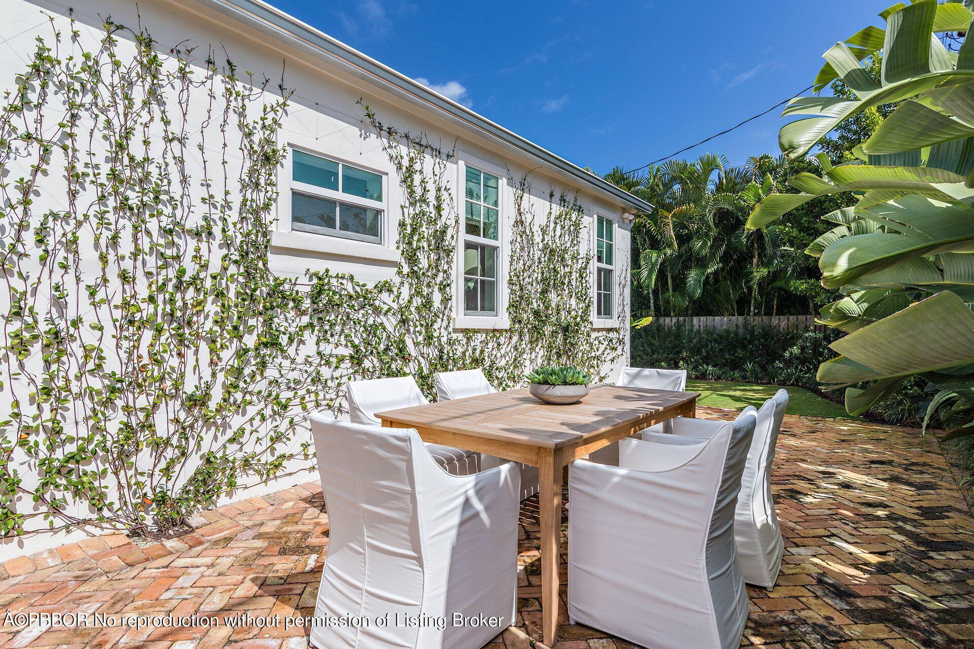 7610 Washington Road West Palm Beach, FL 33405 - Photo 9 of 12 a view of an outside dining space with furniture