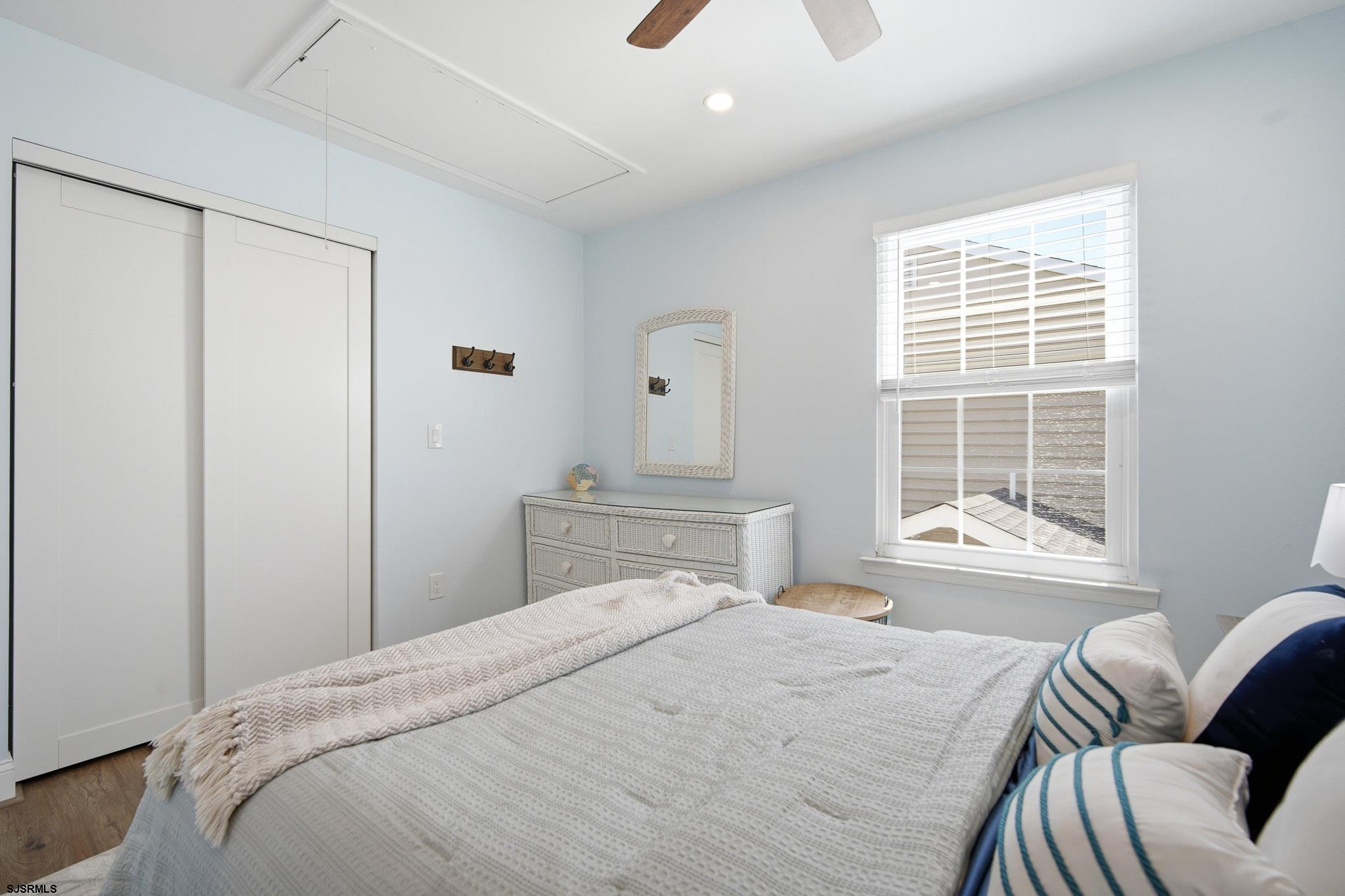 214 Hagen Road Brigantine, NJ 08203 - Photo 22 of 34 a bedroom with a bed and window