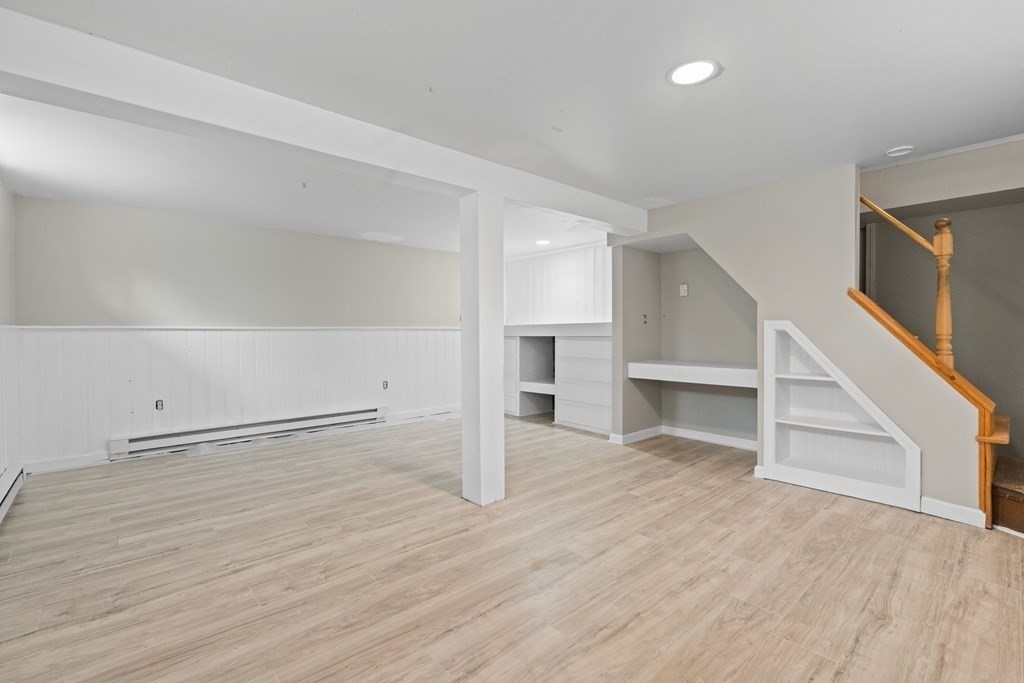 321 Winthrop Street Rehoboth, MA 02769 - Photo 16 of 16 an empty room with wooden floor and windows