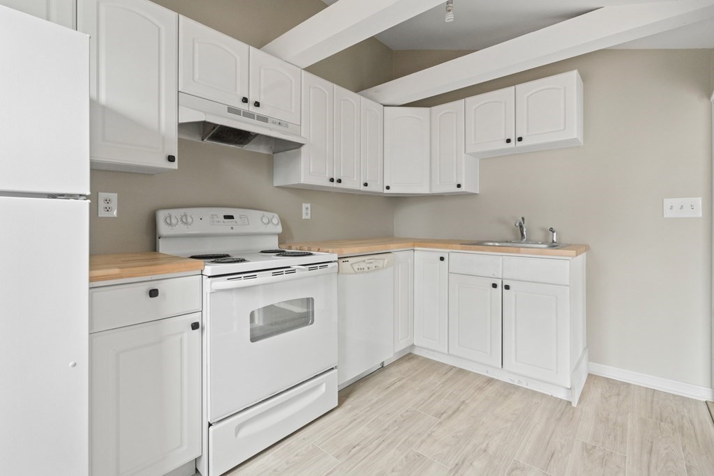 321 Winthrop Street Rehoboth, MA 02769 - Photo 4 of 16 a kitchen with appliances cabinets and a sink