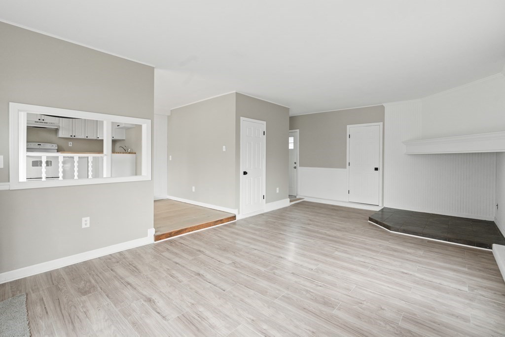321 Winthrop Street Rehoboth, MA 02769 - Photo 7 of 16 a view of empty room with wooden floor and fan