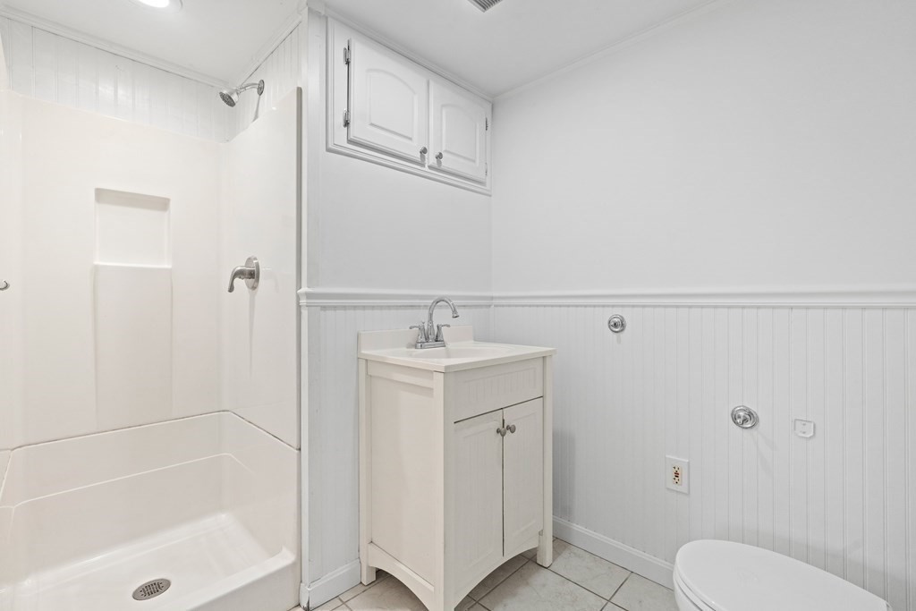 321 Winthrop Street Rehoboth, MA 02769 - Photo 9 of 16 a bathroom with a sink a toilet and shower