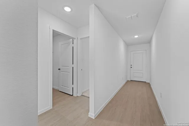 an empty room with closet area