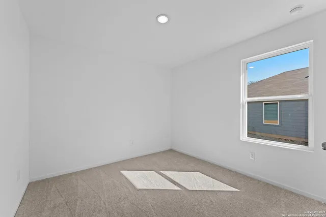 a view of a hallway with a room