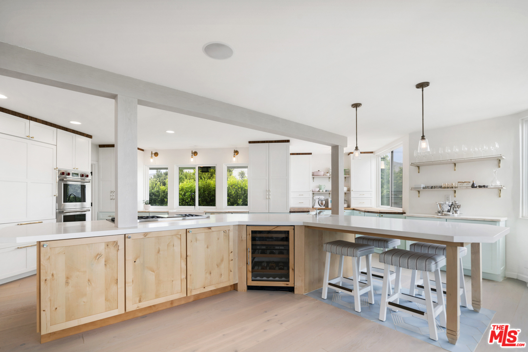 6272 Cavalleri Road Malibu, CA 90265 - Photo 13 of 47 a kitchen with a sink and cabinets