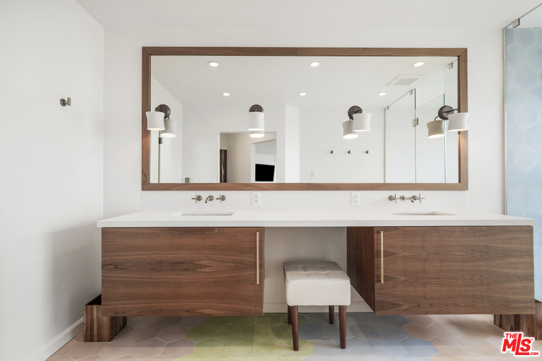 6272 Cavalleri Road Malibu, CA 90265 - Photo 22 of 47 a bathroom with a sink and a mirror