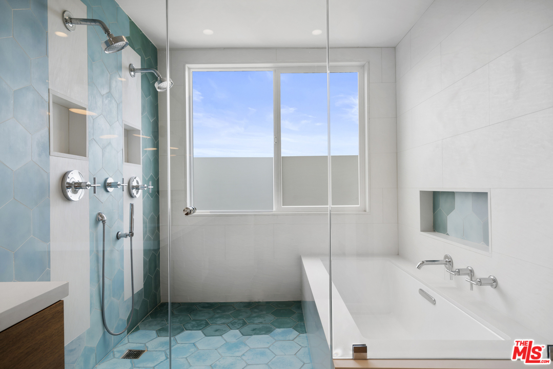 6272 Cavalleri Road Malibu, CA 90265 - Photo 23 of 47 a bathroom with a sink and shower