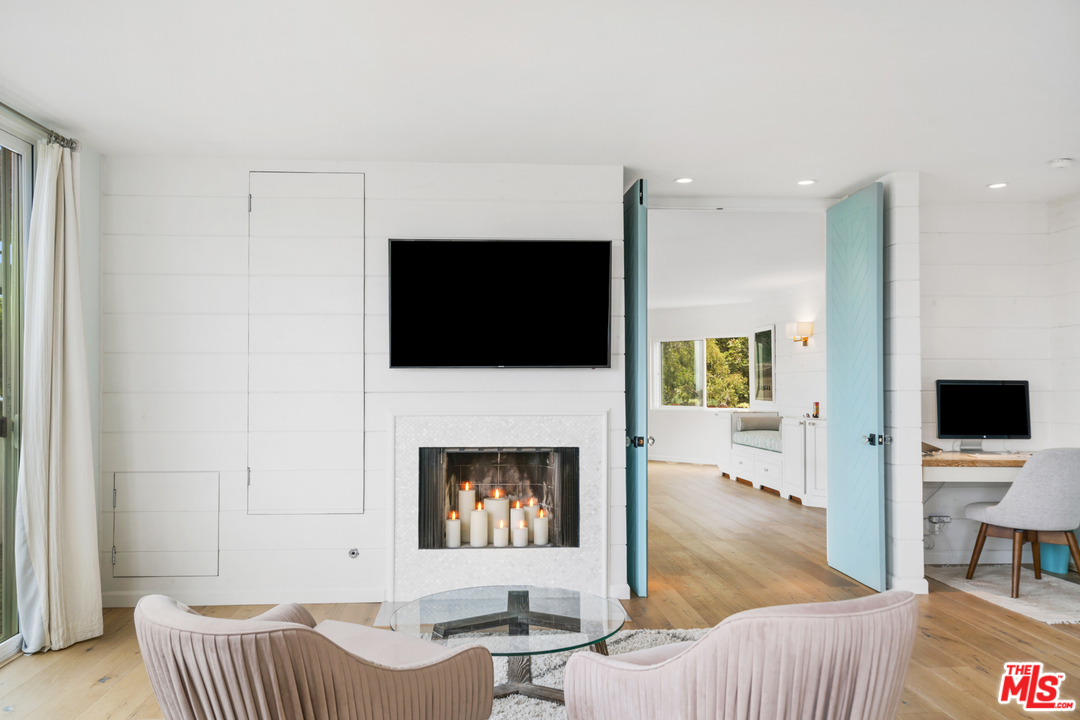 6272 Cavalleri Road Malibu, CA 90265 - Photo 26 of 47 a living room with furniture and a flat screen tv