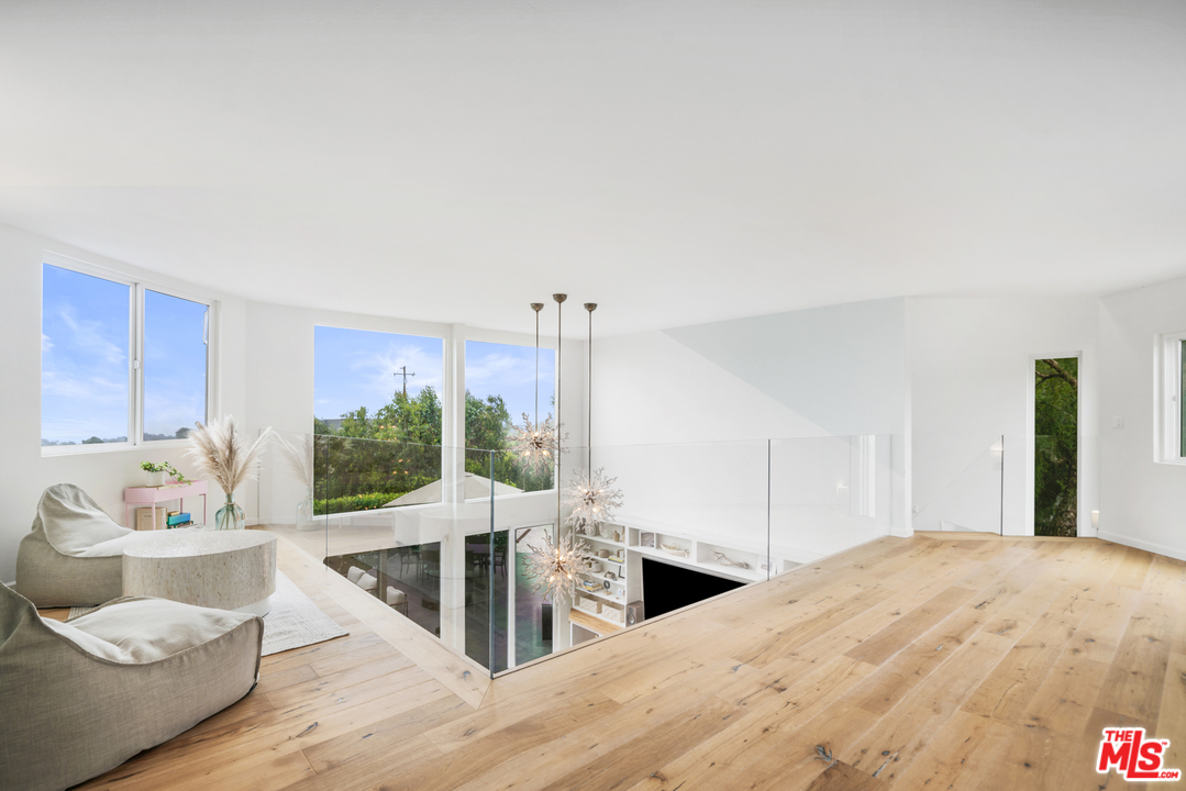 6272 Cavalleri Road Malibu, CA 90265 - Photo 27 of 47 a living room with furniture and wooden floor