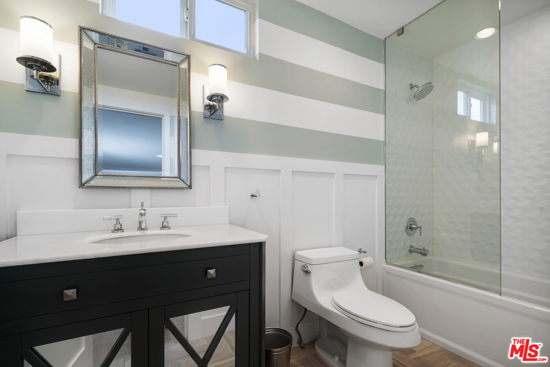 6272 Cavalleri Road Malibu, CA 90265 - Photo 29 of 47 a bathroom with a toilet a sink and a mirror