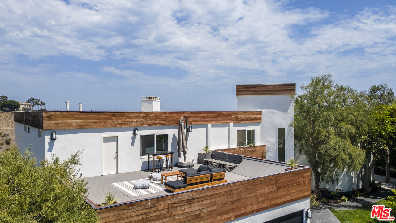 6272 Cavalleri Road Malibu, CA 90265 - Photo 30 of 47 a view of a house with backyard and sitting area