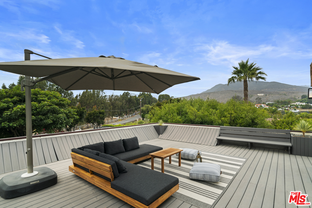 6272 Cavalleri Road Malibu, CA 90265 - Photo 31 of 47 a view of sitting area with furniture and umbrella