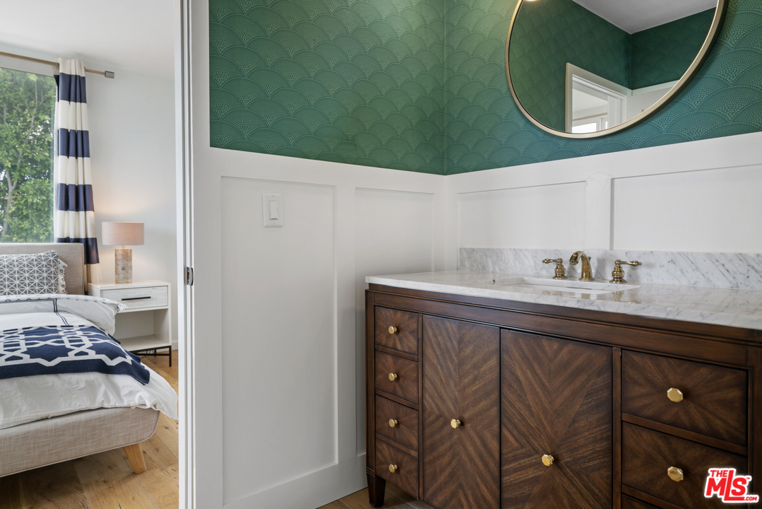 6272 Cavalleri Road Malibu, CA 90265 - Photo 33 of 47 a bathroom with a sink and a mirror