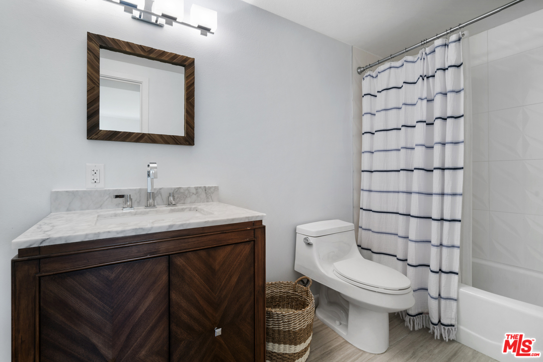 6272 Cavalleri Road Malibu, CA 90265 - Photo 38 of 47 a bathroom with a sink toilet and mirror