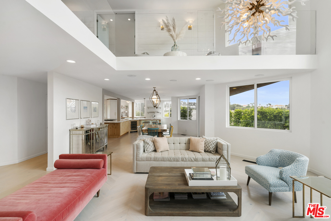6272 Cavalleri Road Malibu, CA 90265 - Photo 8 of 47 a living room with furniture and a chandelier
