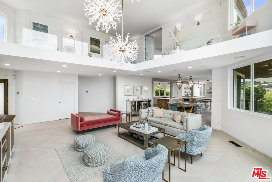 6272 Cavalleri Road Malibu, CA 90265 - Photo 9 of 47 a living room with furniture and chandelier