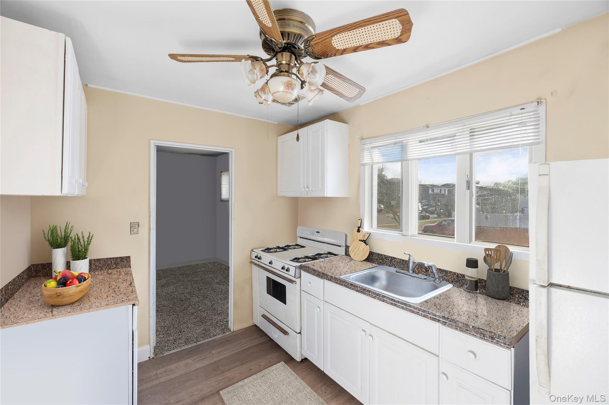 2 Kroll Street Plainview, NY 11803 - Photo 14 of 29 a kitchen with stainless steel appliances granite countertop a sink stove and refrigerator