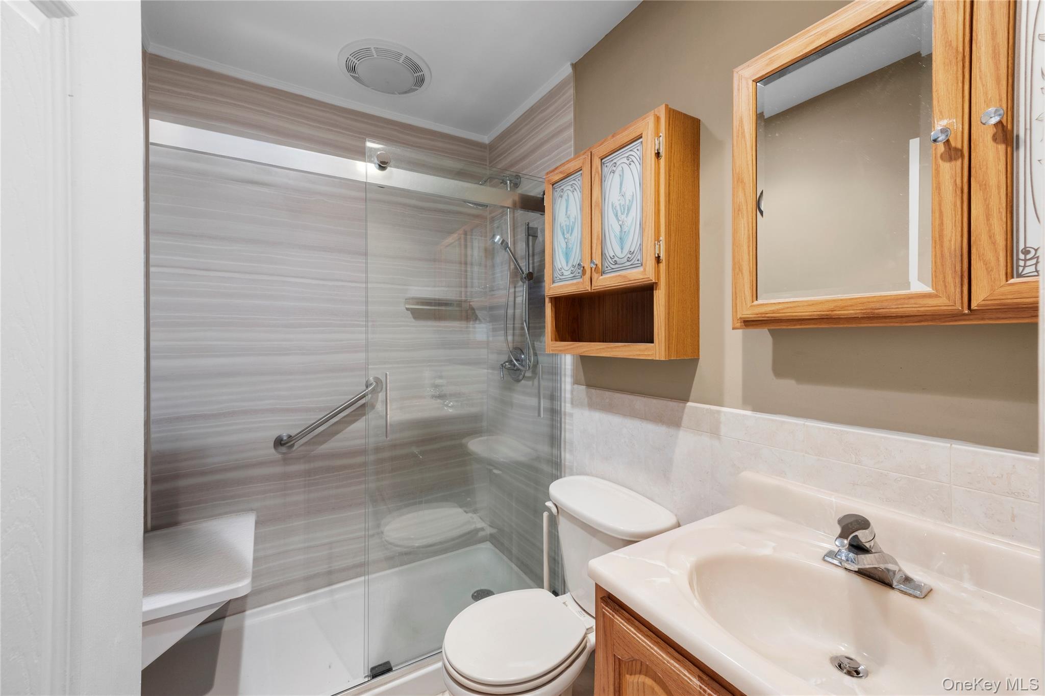 2 Kroll Street Plainview, NY 11803 - Photo 17 of 29 a bathroom with a sink toilet and shower