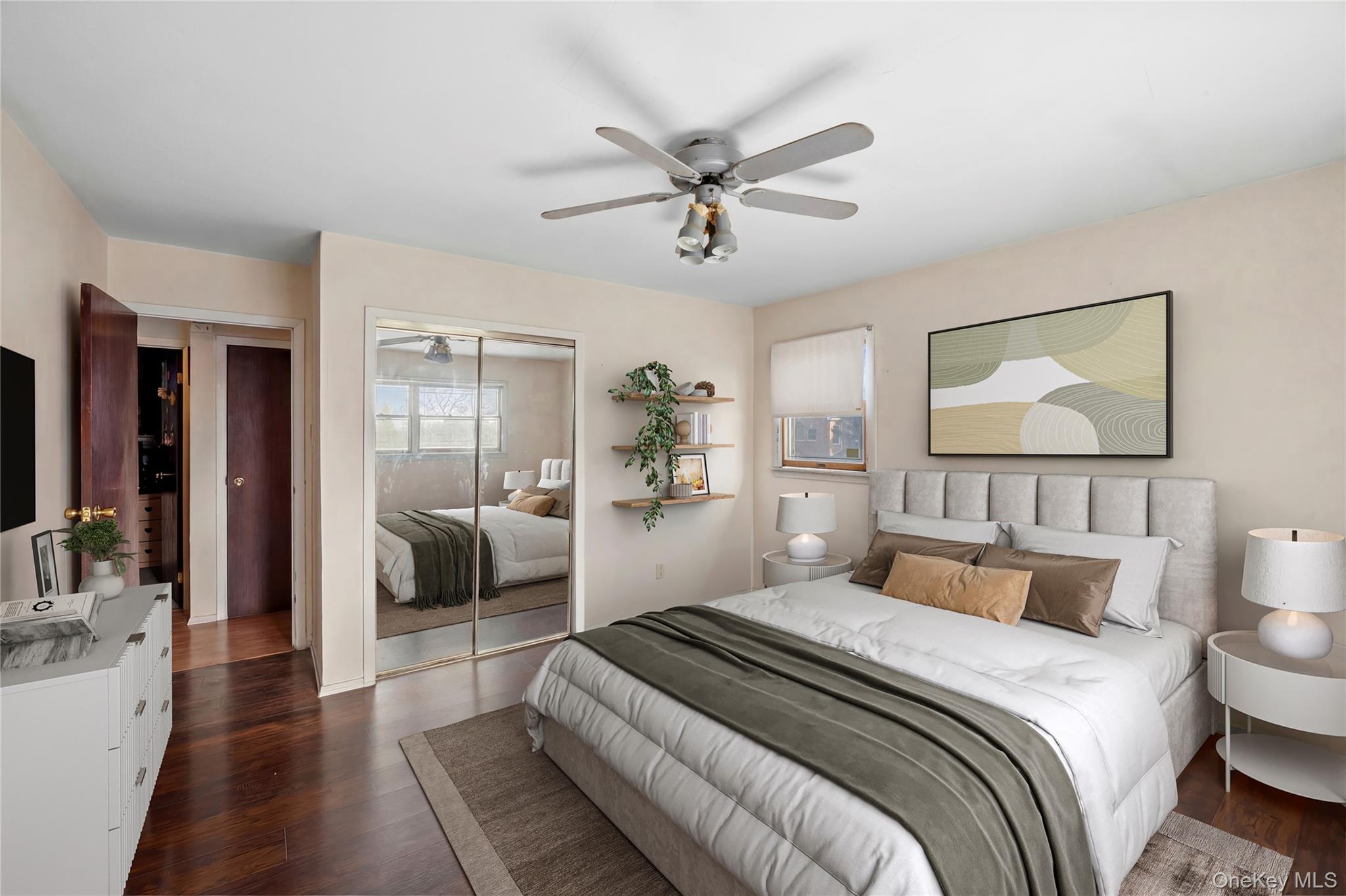 2 Kroll Street Plainview, NY 11803 - Photo 18 of 29 a bedroom with a large bed and a chandelier