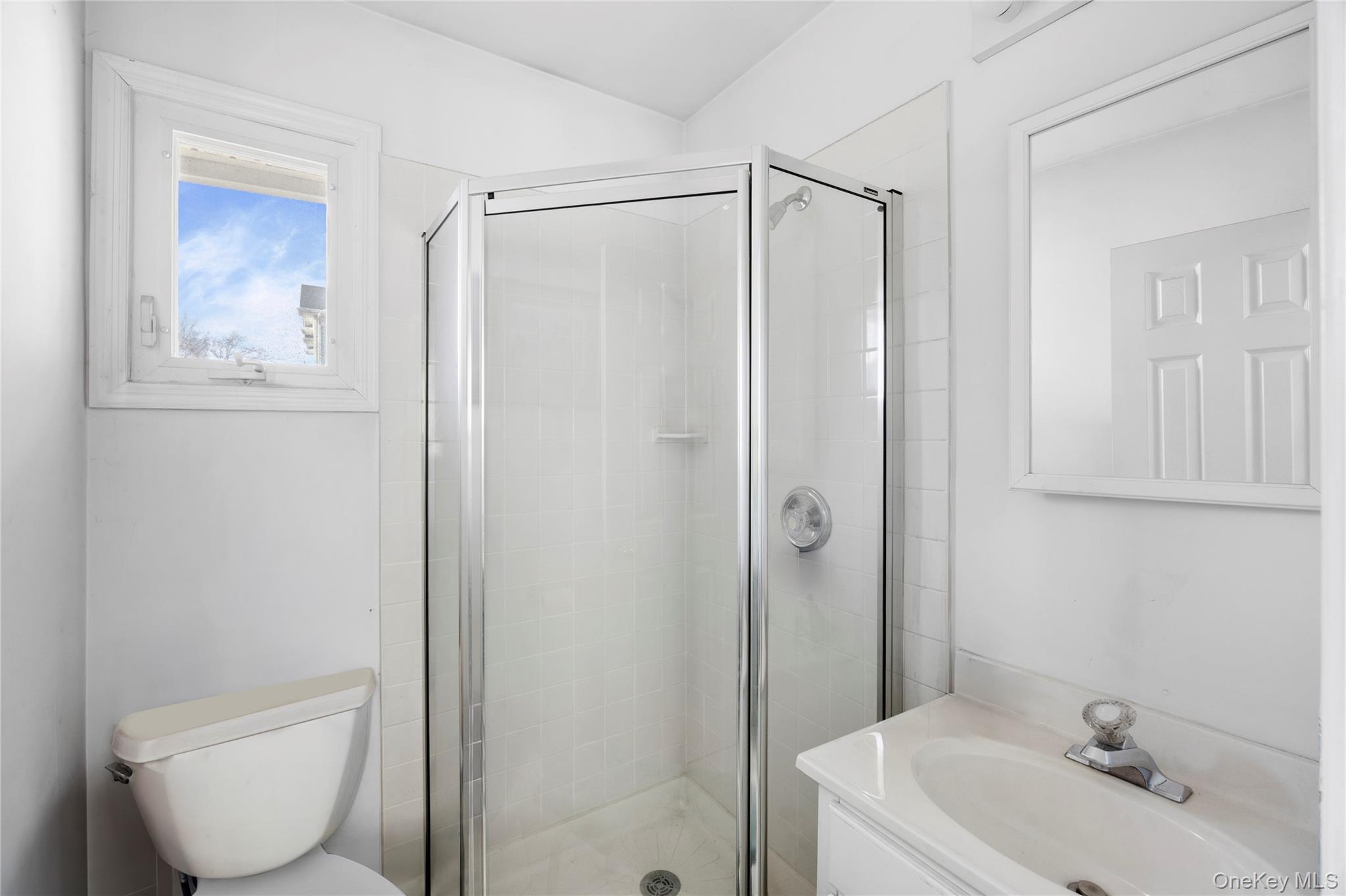 2 Kroll Street Plainview, NY 11803 - Photo 22 of 29 a bathroom with a shower a toilet and sink