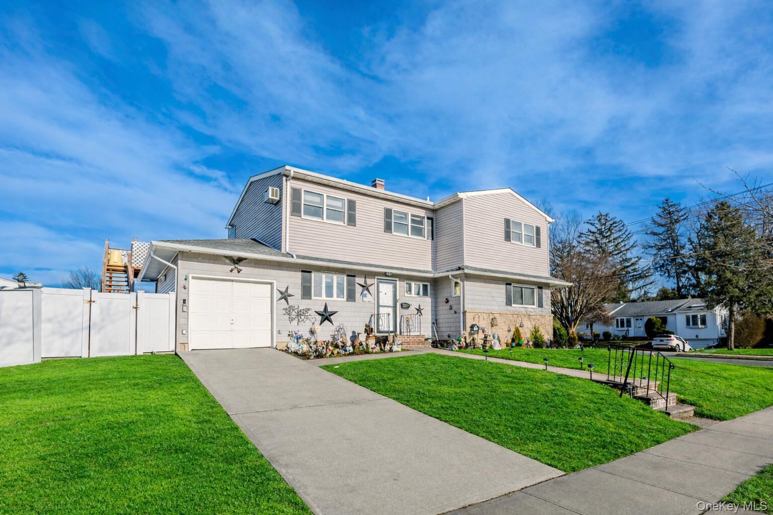 2 Kroll Street Plainview, NY 11803 - Photo 5 of 29 a view of house with yard and green space