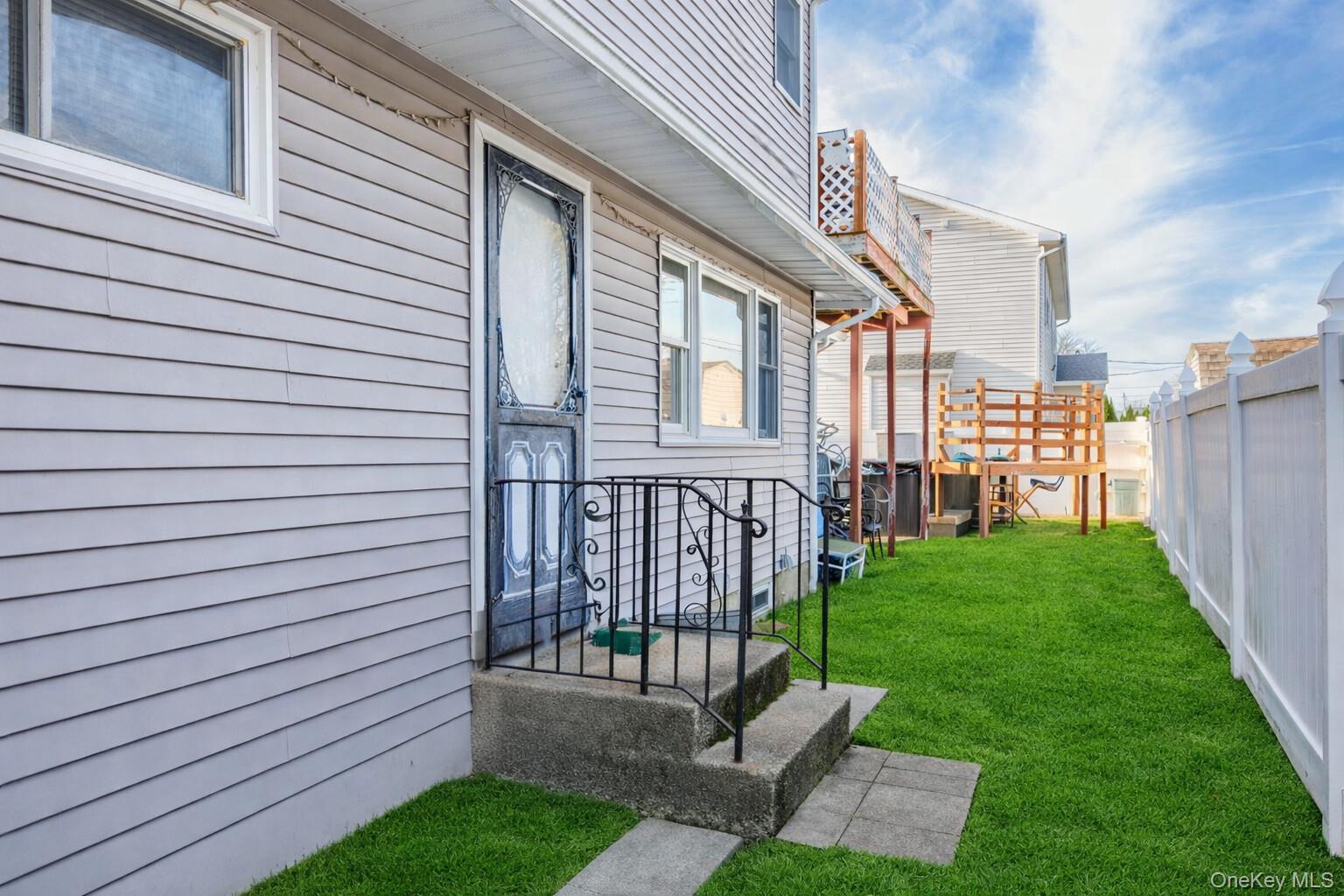 2 Kroll Street Plainview, NY 11803 - Photo 6 of 29 a view of a porch with a garden