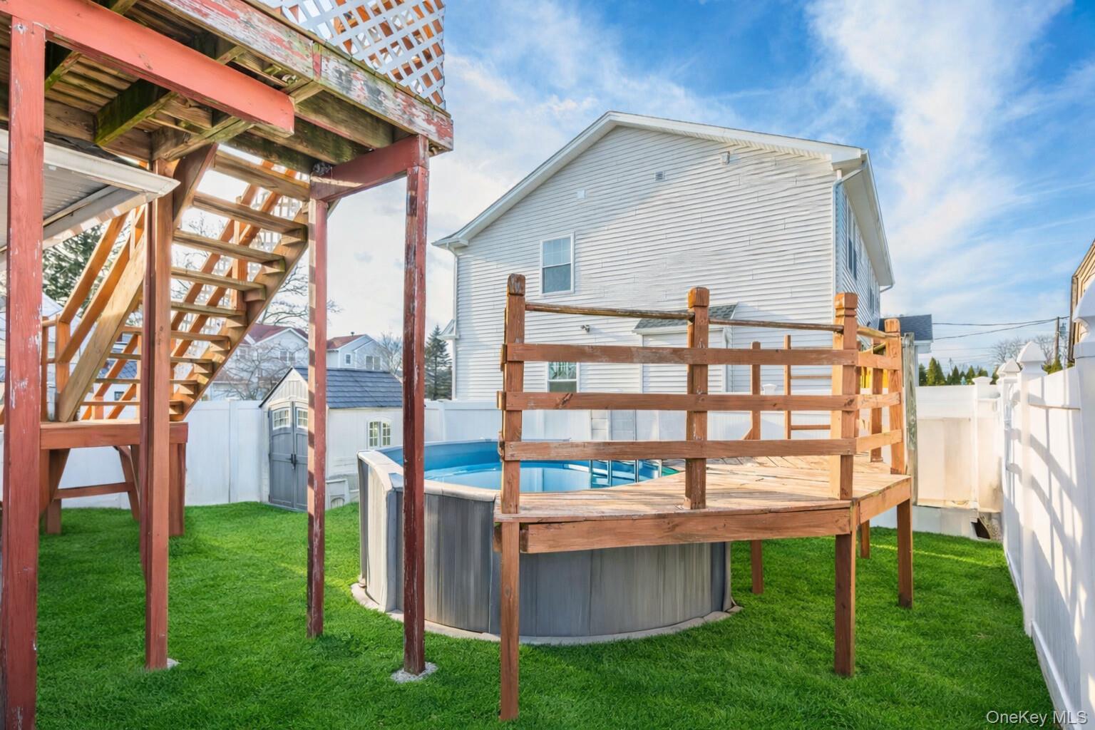 2 Kroll Street Plainview, NY 11803 - Photo 7 of 29 a view of a house with a yard and sitting area
