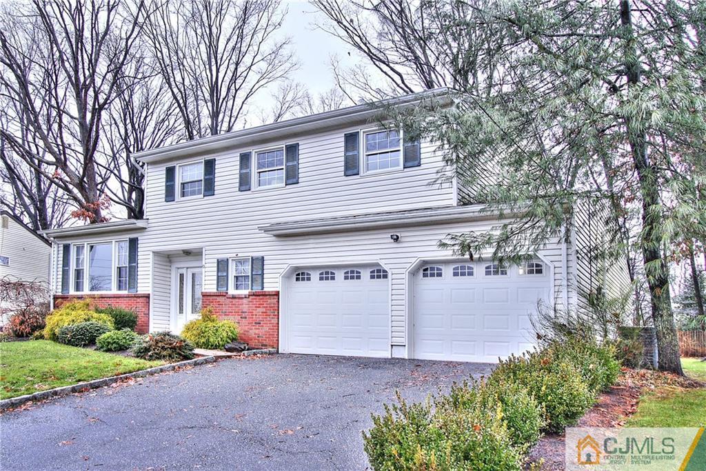 9 Cardinal Avenue Edison, NJ 08820 - Photo 2 of 20 a view of a house with a yard and potted plants