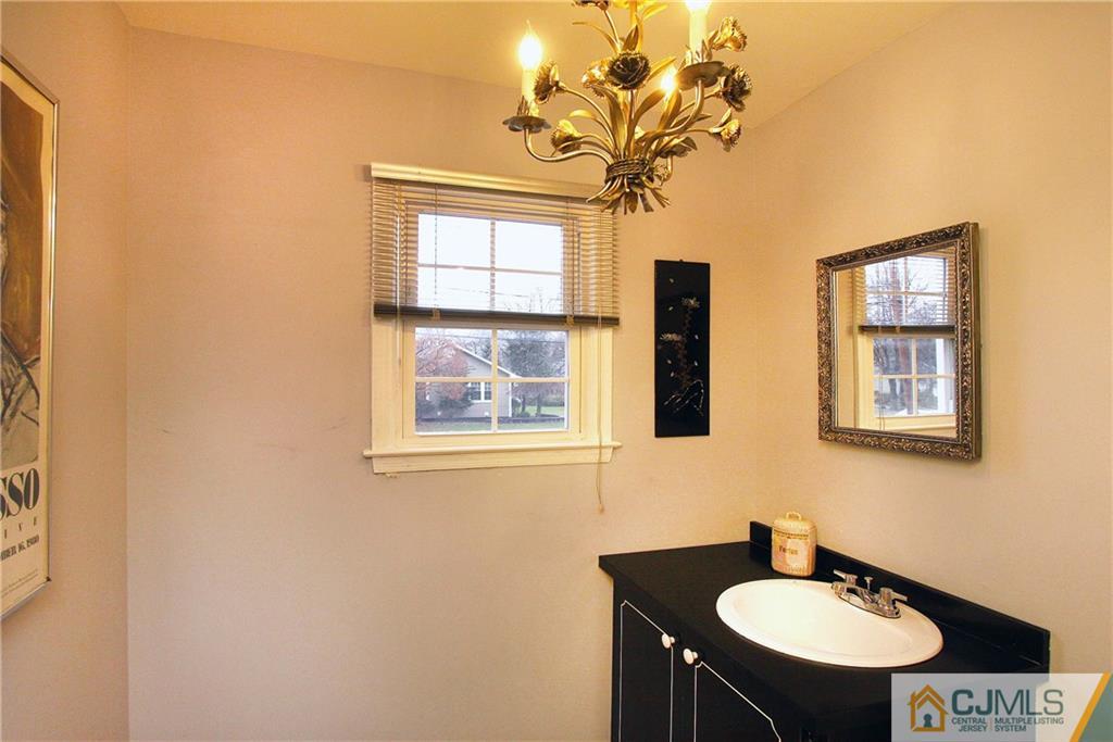 9 Cardinal Avenue Edison, NJ 08820 - Photo 11 of 20 a bathroom with a sink and a mirror