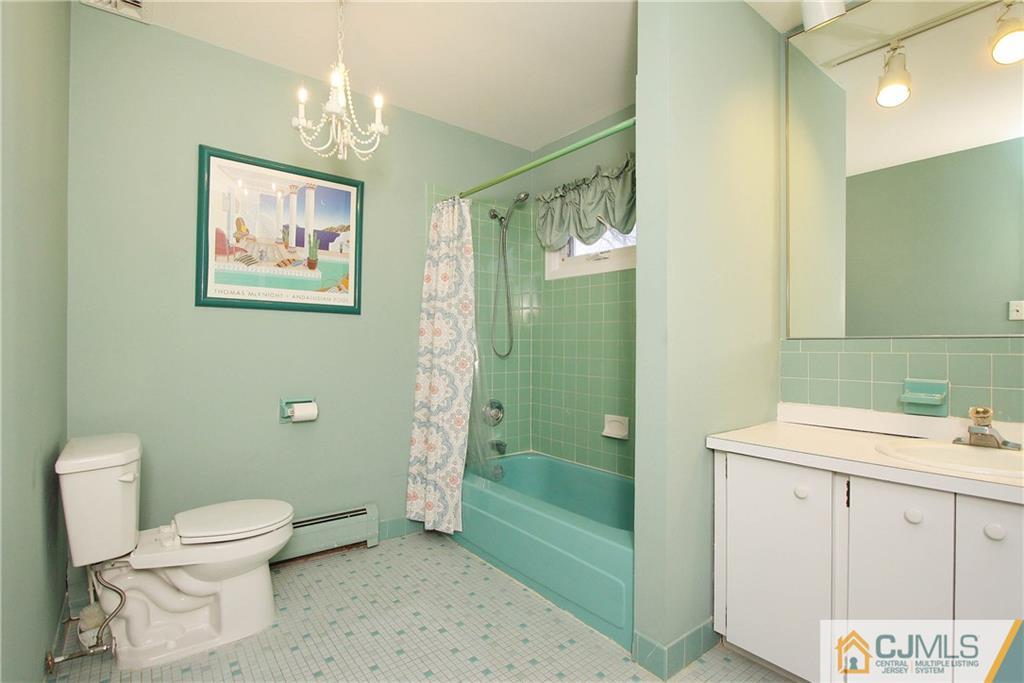 9 Cardinal Avenue Edison, NJ 08820 - Photo 17 of 20 a bathroom with a toilet sink and shower