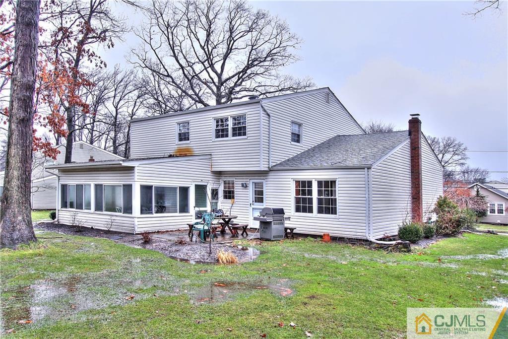 9 Cardinal Avenue Edison, NJ 08820 - Photo 20 of 20 a view of a house with a backyard and a patio