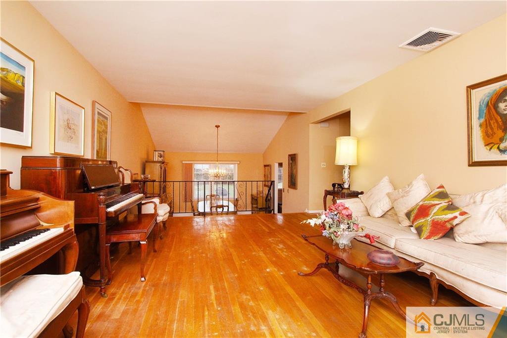 9 Cardinal Avenue Edison, NJ 08820 - Photo 5 of 20 a living room with furniture and a wooden floor