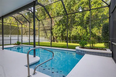a view of swimming pool with a patio