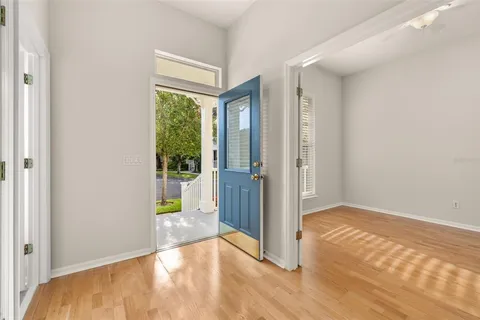 a view of livingroom with hardwood floor and a ceiling fan