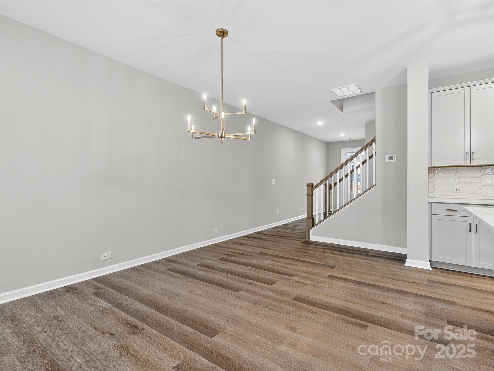 11439 Prosperity Church Road Huntersville, NC 28078 - Photo 11 of 34 a view of empty room with wooden floor